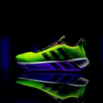 A neon green shoe with a black background