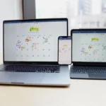 a couple of laptops on a table