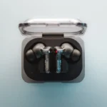 A pair of ear buds sitting in a case