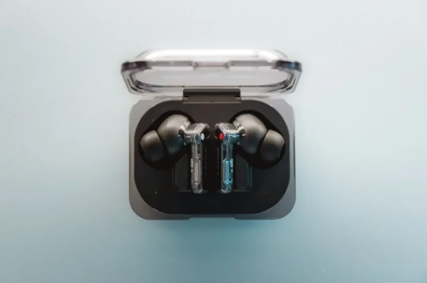 A pair of ear buds sitting in a case