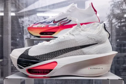 A pair of shoes on display in a glass case