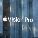 the apple vision pro logo is reflected in the glass of a building