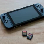 a nintendo wii game system sitting on top of a wooden table