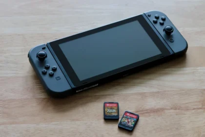 a nintendo wii game system sitting on top of a wooden table