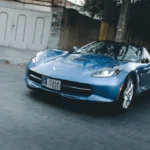 blue porsche 911 parked on street during daytime