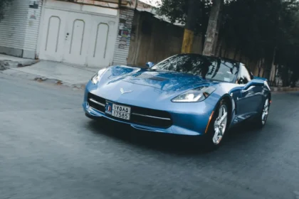 blue porsche 911 parked on street during daytime