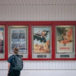 A person looks at movie posters.