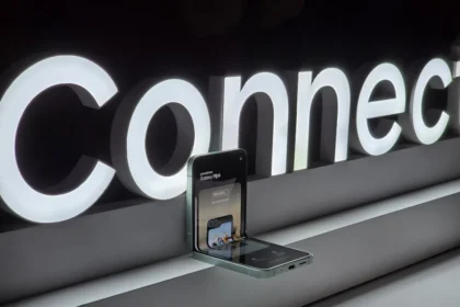 A cell phone is plugged into a connection sign