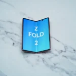 a blue sign on a white surface