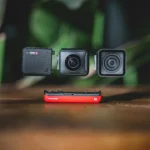 black and red speaker on brown wooden table