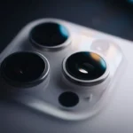 Close-up shows the triple-lens camera on a phone.