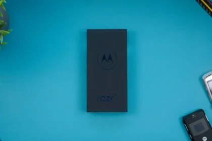 a motorola cell phone sitting on top of a blue table