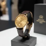 Nomos Tangente Gold Watch Signals Precious Metal Shift — AI-generated illustration
