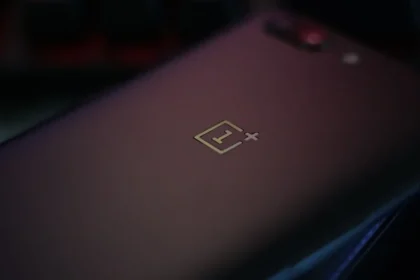 black smartphone on black textile