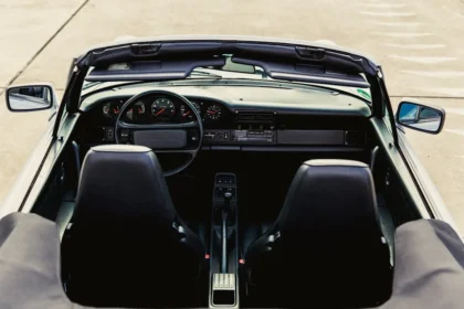 the dashboard of a car is shown from above