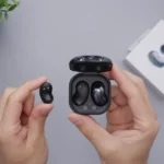 person holding black game controller