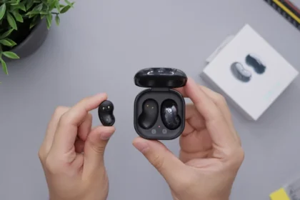 person holding black game controller