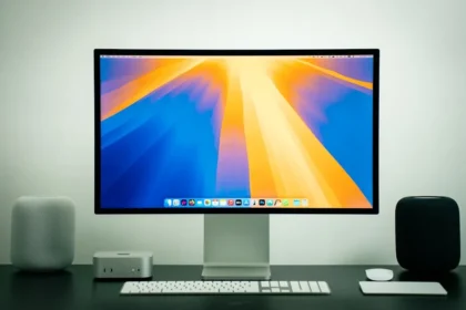 A computer monitor sitting on top of a desk