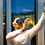 a man in a white shirt wearing a pair of virtual glasses