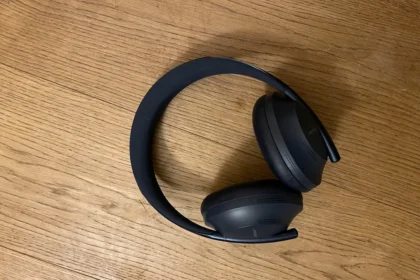 a pair of headphones sitting on top of a wooden table