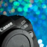 black nikon dslr camera on blue and white lights