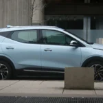 a blue car parked on the side of the road