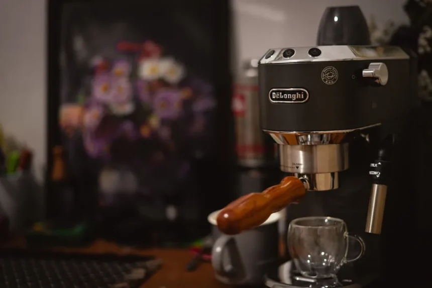 An espresso machine with a hot dog on top of it