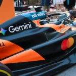 Mclaren formula 1 car with gemini and mastercard logos