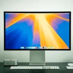 A computer monitor sitting on top of a desk