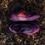 purple and white nike athletic shoes