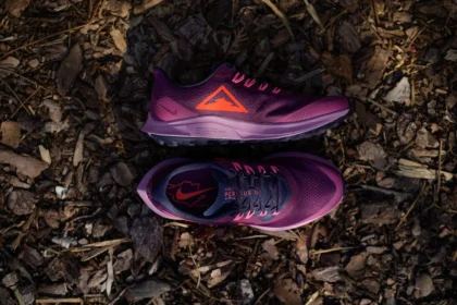 purple and white nike athletic shoes