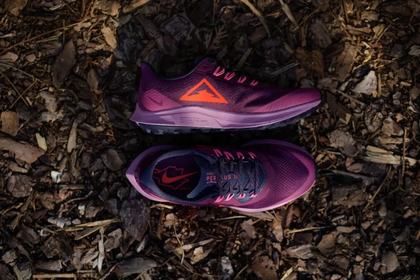 purple and white nike athletic shoes