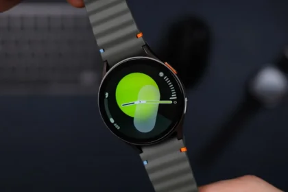 A close up of a person holding a smart watch