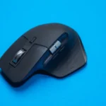a computer mouse sitting on top of a blue surface