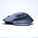 black cordless computer mouse on white surface
