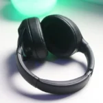 black and gray headphones on white table