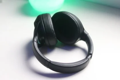 black and gray headphones on white table