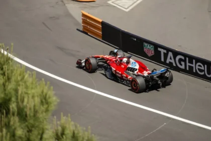 A formula 1 car speeds around a racetrack.